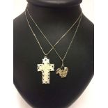 2 pendants on silver chains - one is a cross carved from mother of pearl, measures 4.5cm long. The