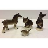 4 Lomonosov USSR animal figures comprising: Upright brown bear approx 14cm tall, brown bear on all