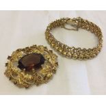 2 pieces of vintage Sarah Coventry costume jewellery comprising: 1. Goldtone oval brooch with leaf