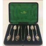 A cased Walker & Hall A1 plate set of 6 teaspoons with sugar tongs.