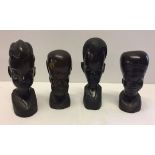 4 carved wood tribal art figures.