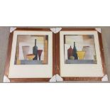 A pair of Hans Paus prints of vases. Framed & glazed. Each 39 x 39cm.