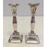 A pair of silver candlesticks hallmarked Birmingham 1931. Approx 15cm tall.