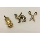 3 gold charms comprising a HM 9ct camel, a HM 9ct scissors (working) and an Owl marked 333 gold.