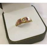Victorian 18ct ring, hallmarked Glasgow 1871, set with small central diamond and 2 rubies. Size N,
