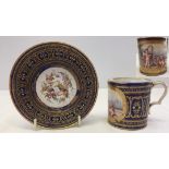 A Dresden cup and trembleuse saucer. Cup with hand painted panel depicting 3 cherubs playing musical