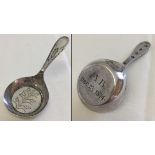A Georgian silver flat bottomed caddy spoon. Hallmarked Birmingham 1799 with later engraving.