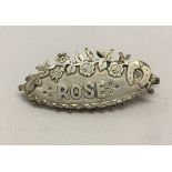 Victorian hallmarked silver sweetheart brooch with the name 'Rose' and floral decoration with a