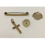 4 small items of gold, comprising: an engine turned bar brooch, heart shaped padlock clasp, a