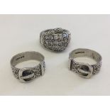 2 silver buckle rings, both size V, together with a hallmarked silver ring in the shape of a