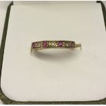 Hallmarked 9ct gold half eternity ring set with rubies and diamonds. Size M, total weight 1.5g.