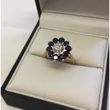 Sapphire & diamond cluster ring in 9ct gold. Size O, total weight approx 3.7g