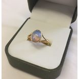 22ct gold dress ring set with an oval opal. Size N, total weight approx 4.4g