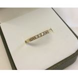 18ct gold half eternity ring set with 7 small tanzanites. Size M, total weight approx 1.2g.