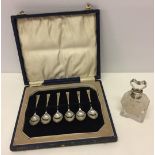 A boxed set of silver coffee spoons Hallmarked Sheffield 1932 together with a cut glass perfume