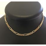 A 9ct gold necklace with safety chain. Measures 15 inches long, weight approx 17.7g.