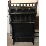 An Arts and Crafts ebonised and gilded dresser top/shelf. Approx 76.5 x 146.5cm.