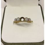 Vintage 18ct gold ring set with 4 opals - centre opal missing. Size L, total ring weight 2g.