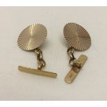 A pair of hallmarked 9ct gold cufflinks with sunburst design. Weight approx 2.3g.