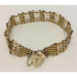 Hallmarked 9ct gold 6 bar gate bracelet with heart shaped 'padlock' clasp and safety chain. Total