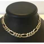 A large 925 silver figaro link necklace. Curb chain total length approx 45cm. Total weight approx