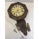 19th century wall clock with brass inlay.