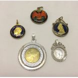 A small collection of enammelled and jewellery mounted coins.
