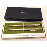 Cross 12ct rolled gold pen and pencil set in original box with operating instructions leaflet.