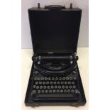 A vintage cased typwriter.