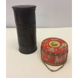 A vintage wooden stacking spice container together with a 1950s toffee tin.