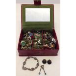 A red box containing an assortment of vintage costume jewellery including micro mosaic.