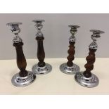 2 pairs of vintage oak and metal candlesticks.