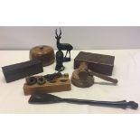 A collection of wooden items to include tribal pieces, a carved box and a gavel and block.