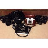 A collection of 5 35mm vintage cameras.