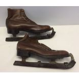 A pair of vintage brown leather ice skates by Collinson.