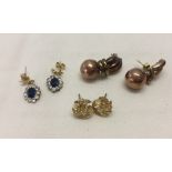 3 pairs of 9ct gold earrings, one set with blue & white stones.