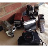 Collection of 7 vintage cine-cameras.