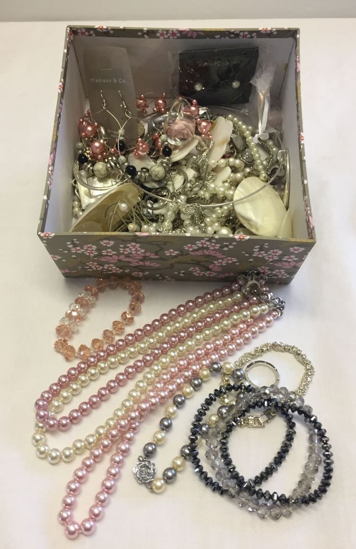 A floral box of good quality modern costume jewellery.