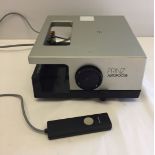 A Prinz autofocus slide projector with remote control.