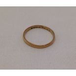 A 22ct gold wedding band.