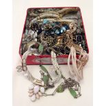 A box containing a collection of modern costume jewellery necklaces.