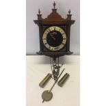 A vintage Warmink pendulum wall clock.