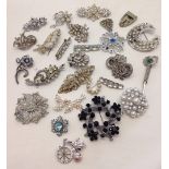 A collection of vintage diamante brooches.