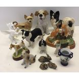 A collection of resin and ceramic animals, mostly dogs.