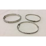 2 hinged hallmarked silver bangles together with a sterling silver expanding braclet.