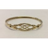 9ct gold bangle with celtic style design.