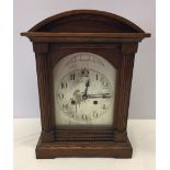 A vintage wooden cased mantle clock made by Wutemburg in Germany.