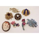 8 vintage brooches including 2 by Sarah Coventry and a cameo that can also be worn as a pendant.