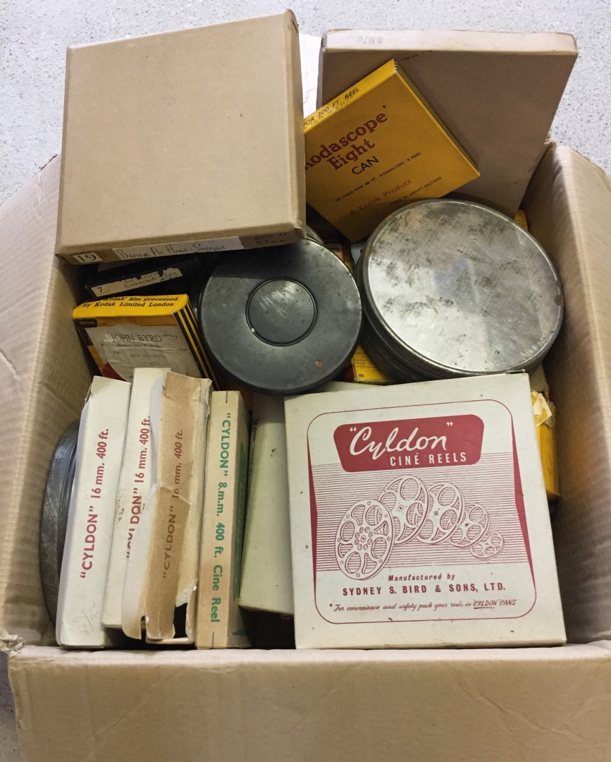 A box containing a large quantity of 8 & 16mm cine films.