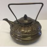 A vintage copper kettle.